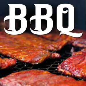 A close-up of many racks of slow-smoked pork ribs laid out on the grills of the 1000-gallon smokers at Morse et Marteaux BBQ Smokehouse in Shediac, NB