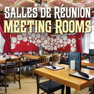 The tables in Le Moque-Tortue's tea room are set up with menus and roll-ups.