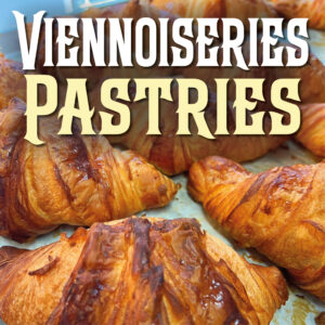 A tray of freshly-baked croissants from Adorable Chocolat, with the words "Viennoiseries" and "Pastries" written above.