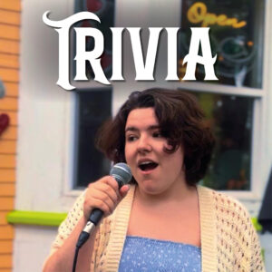 Gab hosting trivia on Le Moque-Tortue's patio during the summer